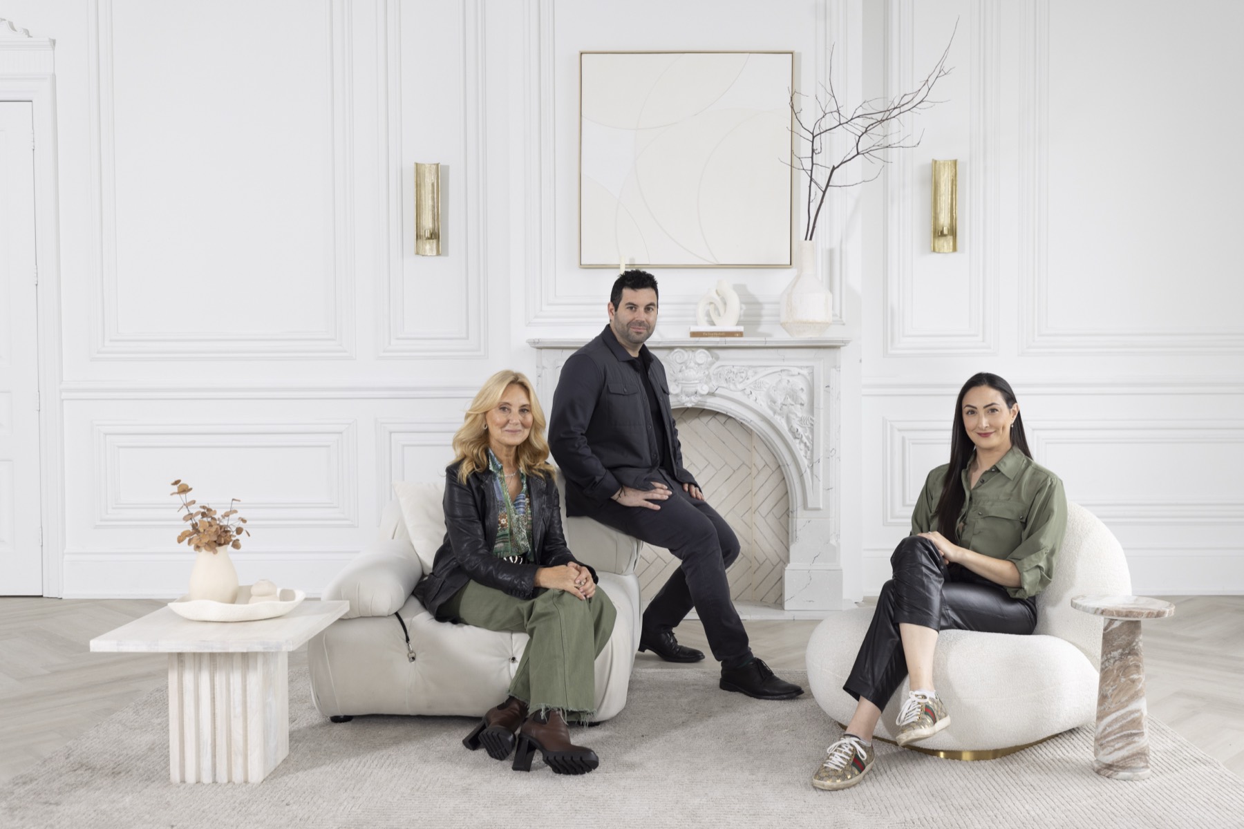 Catherine, Richard and Rebecca Himelfarb in a white room with a marble fireplace